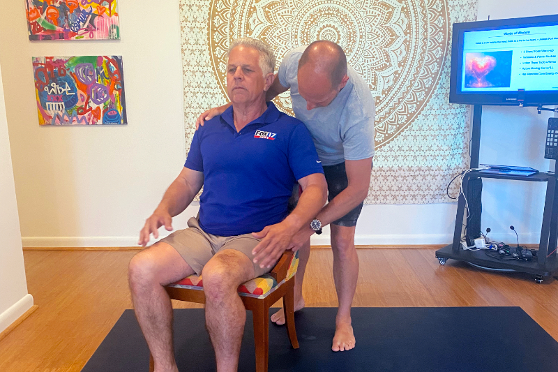 Tommy assisting a client during training.